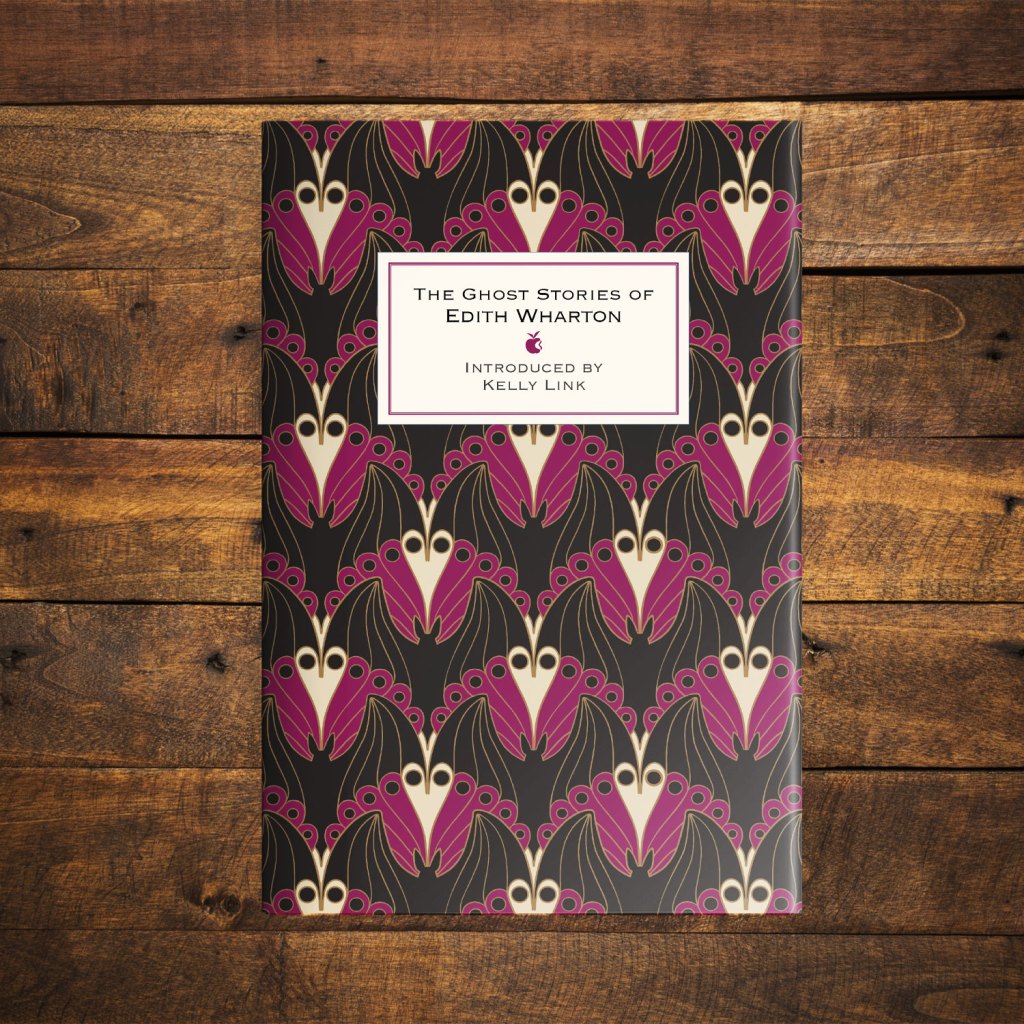 The Ghost Stories of Edith Wharton on a dark wood background
